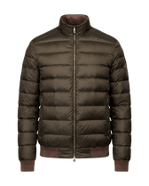 Green puffer jacket with brand logo on a black background