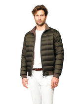 Man wearing a green puffer jacket on a white background
