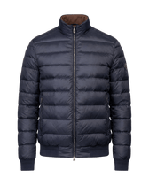 Blue puffer jacket on a black background