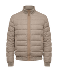 Beige puffer jacket on a black background