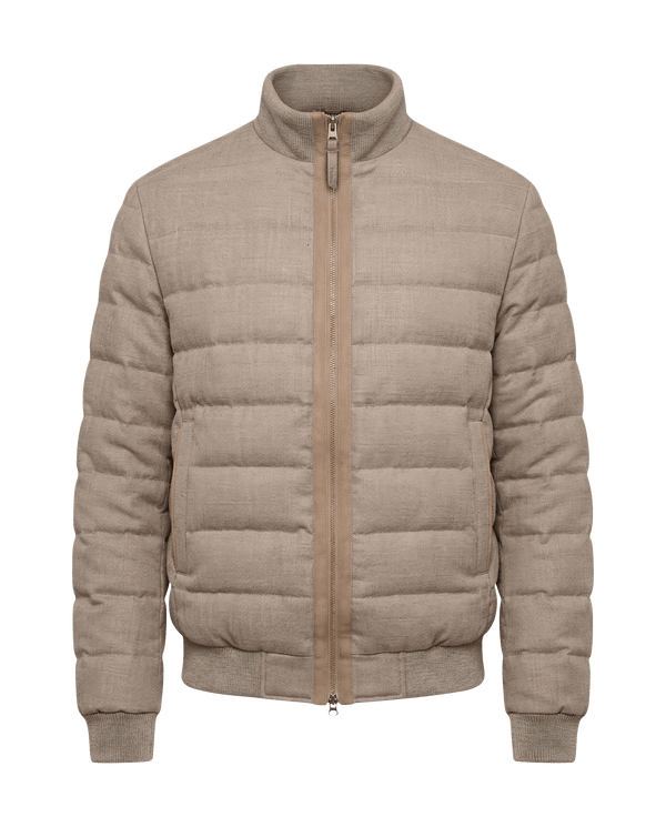 Beige puffer jacket on a black background