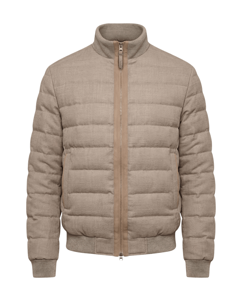 Beige puffer jacket on a black background